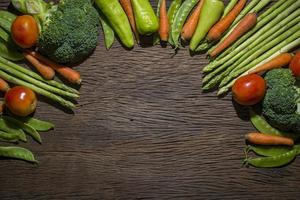 Green vegetables on wood background photo
