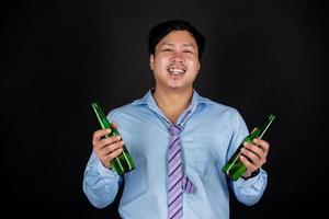 Cropped close up of a man drinking beer at the home photo