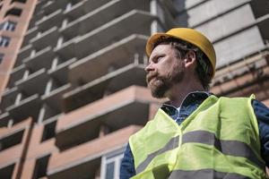 mustache brigadier bearded foreman in a yellow helmet photo