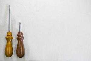 screwdriver with wooden handle on white background copy space photo
