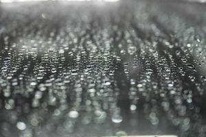 raindrops on the car window background photo