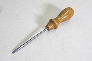 screwdriver with wooden handle on white background copy space photo