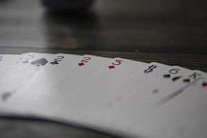 playing cards on the table beautiful wooden background copy space photo