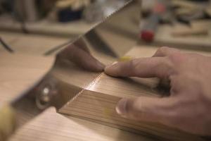 joiner sawing with a saw photo