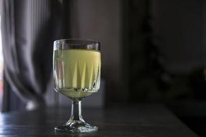 wine glass with lemonade in a summer cafe photo