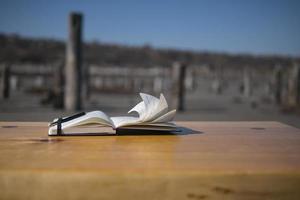 Notebook on the table in nature photo