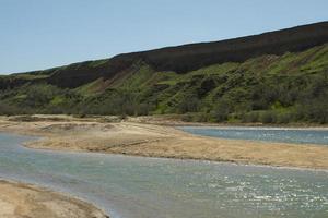 salt lake and green hills photo