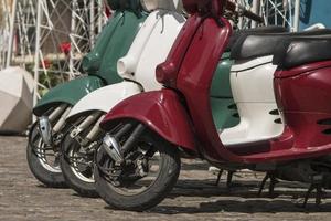 three mopeds painted in colors of the Italian flag photo