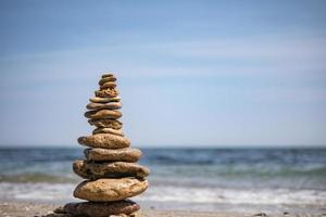 cairn on sea background pyramid wallpaper photo