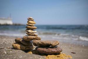 cairn on sea background pyramid wallpaper photo