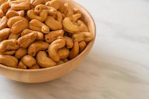 Cashew nuts in wooden bowl photo