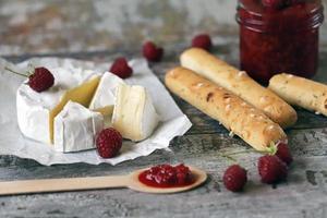 Camembert cheese with raspberry sauce photo