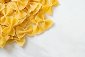 Dry uncooked farfalle pasta photo