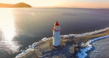 Aerial photography Tokarev lighthouse on the background of the blue sea photo