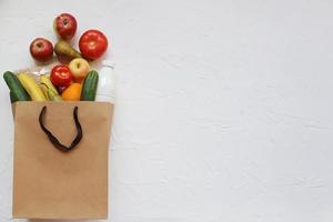 Paper bag vegetables and fruit photo