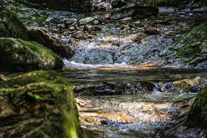 Water flowing through rocks photo