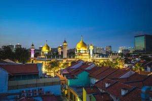 Street and Sultan Masjid at night in Singapore photo