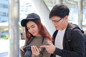 couple asian tourists and traveling in the city happily photo