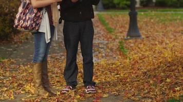 Three college students talking together on campus video