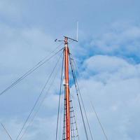 sailboat wooden mast in the seaport photo