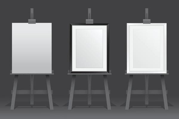 Wooden easel stands with picture frames on black background