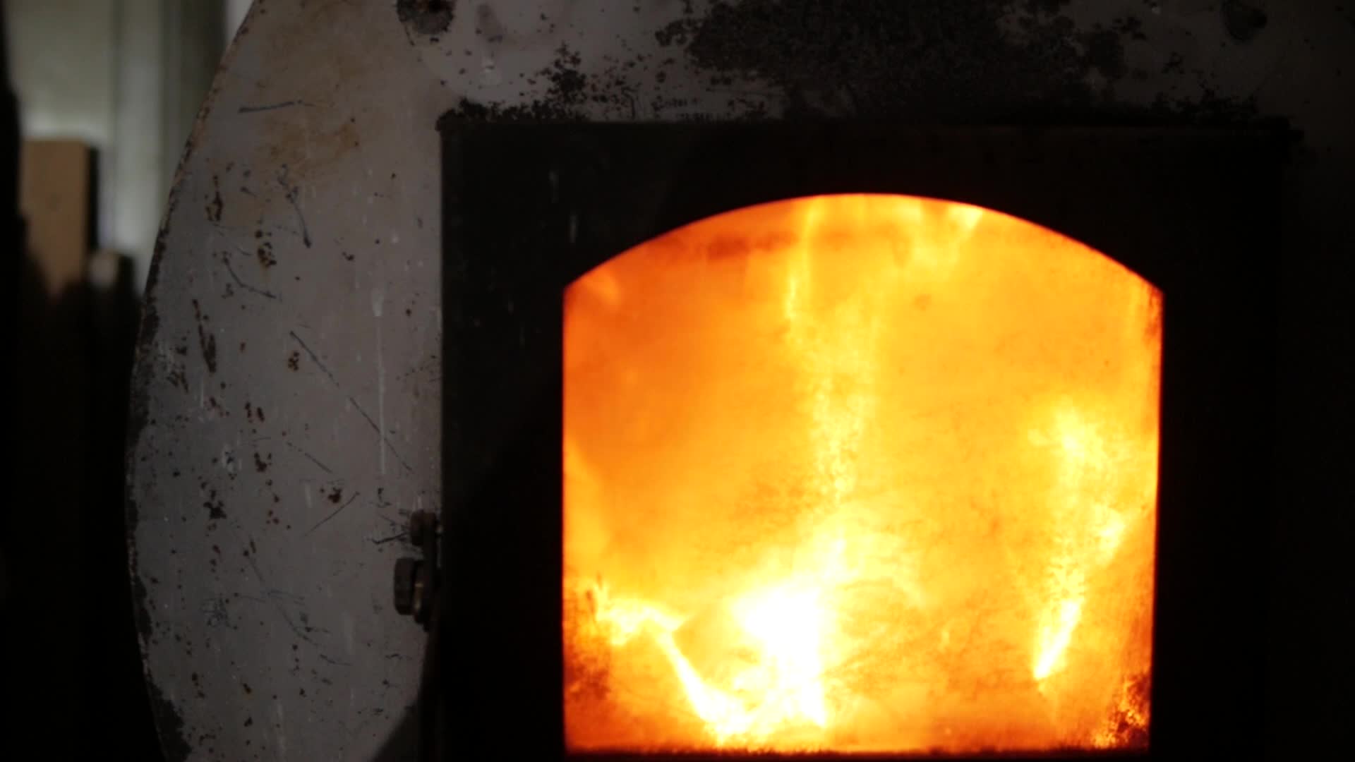 Fire is beautifully lit in a cast iron stove 2561256 Stock Video at