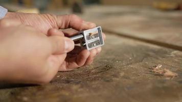 Male hand sharpens a pencil on the sharpener video