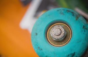 Close up of blue wheels of a skateboard photo