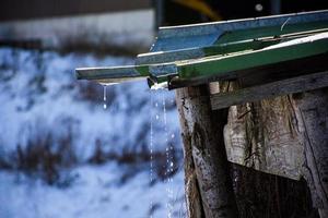 Snow melting in the sun photo