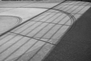 Fence shadow on concrete photo