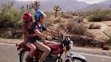 Couple riding together on motorcycle