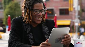 Man using digital tablet outdoors video