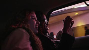 Young couple riding in taxi cab, New York City video