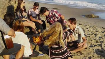 Group of young people together at beach video