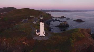 Aerial view of Yaquina Bay Lighthouse at sunset, Newport, Oregon video