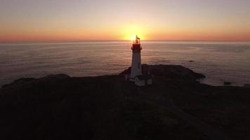 Aerial view of Yaquina Bay Lighthouse at sunset, Newport, Oregon video