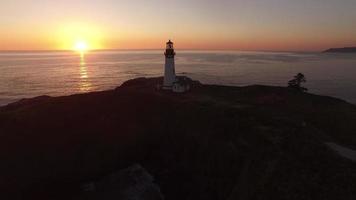 Aerial view of Yaquina Bay Lighthouse at sunset, Newport, Oregon video