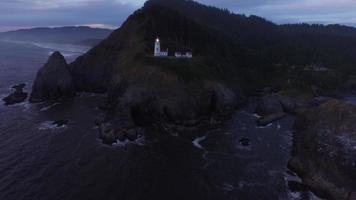 Aerial shot of Heceta Head Lighthouse at sunset, Oregon video