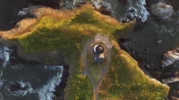 Overhead aerial view of Yaquina Bay Lighthouse at sunset, Newport, Oregon video