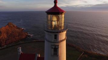 Aerial shot of Heceta Head Lighthouse at sunset, Oregon video