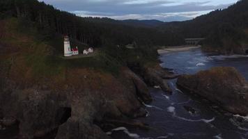 Aerial shot of Heceta Head Lighthouse at sunset, Oregon video