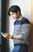 Businessman uses mobile phone to talk on the phone with friends photo