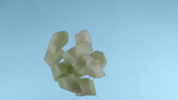 Honeydew melon pieces flying in slow motion, shot with Phantom Flex 4K at 1000 frames per second