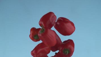 Red peppers flying in slow motion, shot with Phantom Flex 4K at 1000 frames per second video