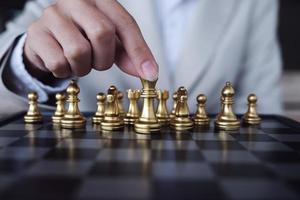 Business competition concept with table chess game photo