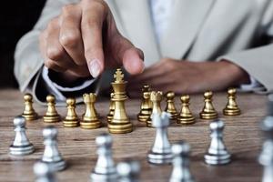 Business competition concept with table chess game photo