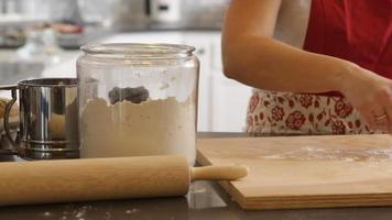 Preparing to roll dough for cookies video