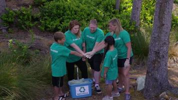 Group of volunteers cleaning up park video