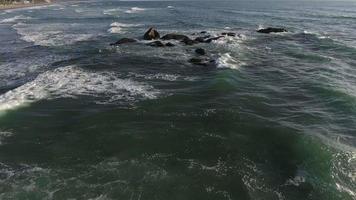 Aerial view of waves crashing on rocks, Lincoln City, Oregon