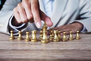 Business competition concept with table chess game photo